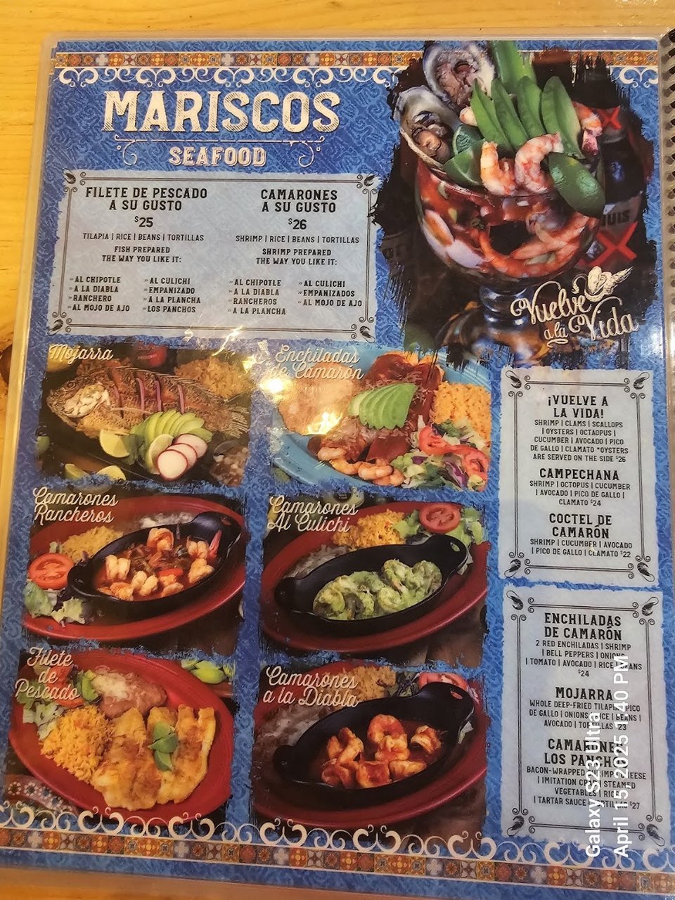 Printed menu pages with Mexican dishes listed.